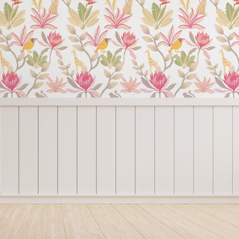South African fynbos wallpaper pattern with protea flowers, birds and safari animals in an inspired botanical design. Colour is pink delight. On wall in a playroom.