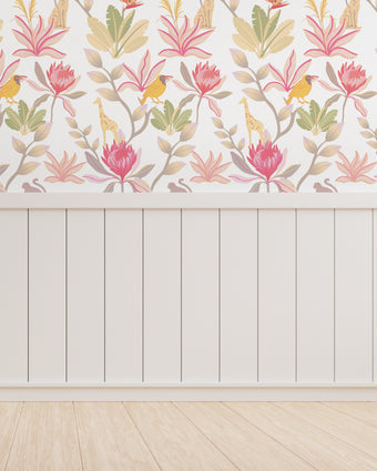 South African fynbos wallpaper pattern with protea flowers, birds and safari animals in an inspired botanical design. Colour is pink delight. On wall in a playroom.