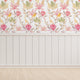 South African fynbos wallpaper pattern with protea flowers, birds and safari animals in an inspired botanical design. Colour is pink delight. On wall in a playroom.