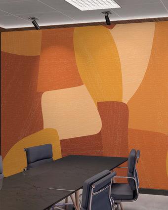 Shades of orange in abstract shapes with a paint brush texture. Blown up on wall in an office meeting room.