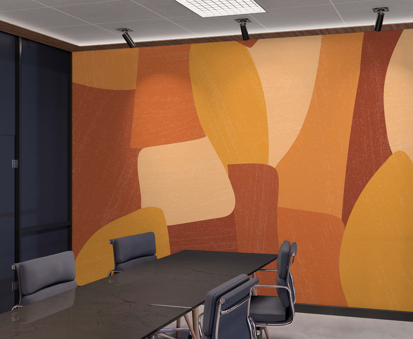 Shades of orange in abstract shapes with a paint brush texture. Blown up on wall in an office meeting room.