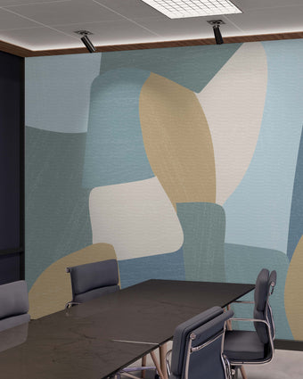 Shades of blues, yellow in abstract shapes with a paint brush texture. Blown up on wall in an office meeting room.