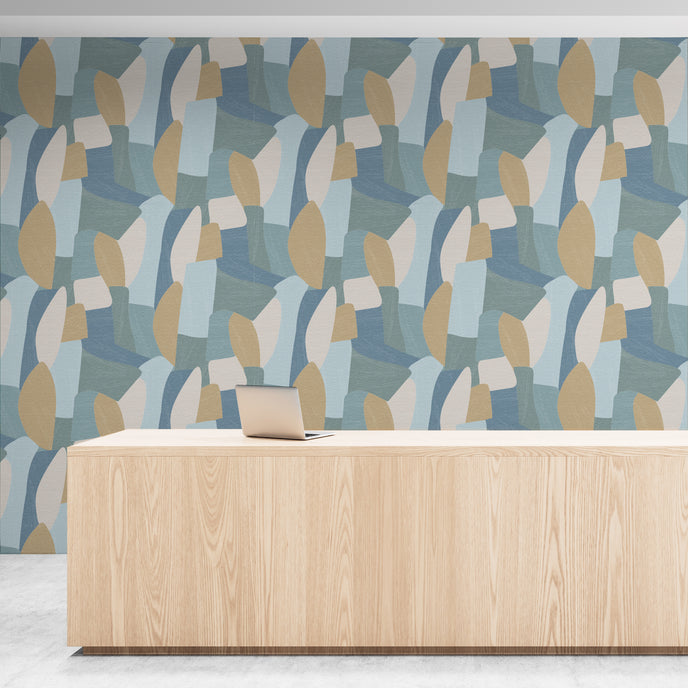 Shades of blues, yellow in abstract shapes with a paint brush texture. On wall in an office reception room.