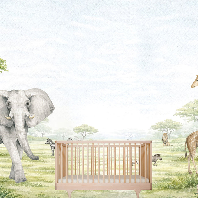 Watercolor safari nursery mural with elephants, giraffes, zebras, lions, warthogs and savannah trees in soft neutral tones. With cot in the centre. 