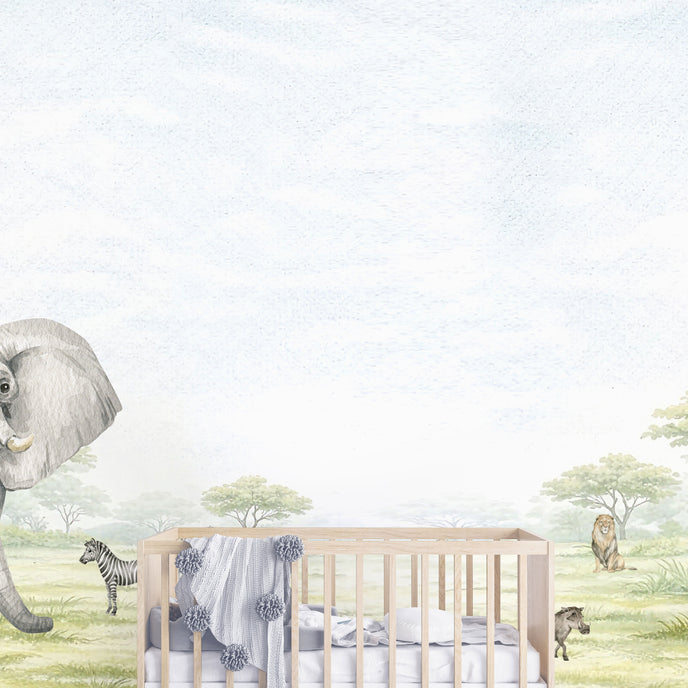 Watercolor safari nursery mural with elephants, giraffes, zebras, lions, warthogs and savannah trees in soft neutral tones. With cot in the centre. 