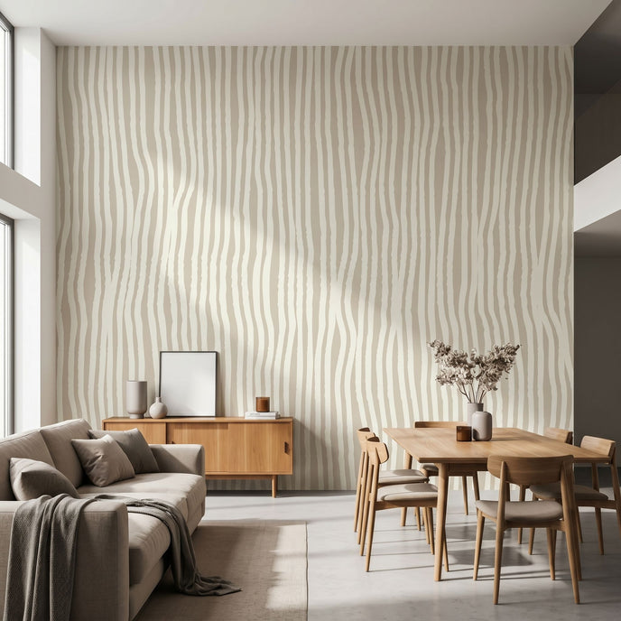 Large custom printed afrocentric geometric mural spilling across a spacious, well-lit living room wall with beige tones and stripe details.