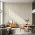 Large custom printed afrocentric geometric mural spilling across a spacious, well-lit living room wall with beige tones and stripe details.