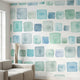 Seamless Aqua Blocks wall mural with pink and teal watercolor geometric pattern in a modern living room.