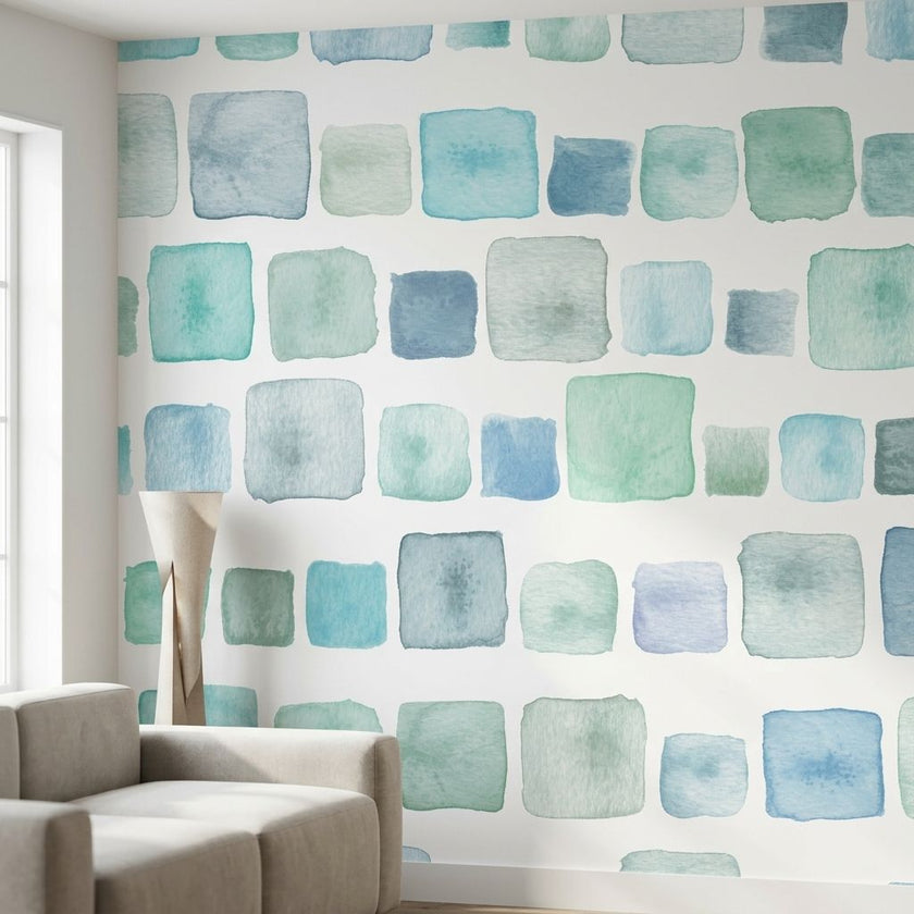 Seamless Aqua Blocks wall mural with pink and teal watercolor geometric pattern in a modern living room.