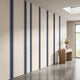 Perspective of a full-wall mural with seamless beige and blue stripes, showcasing size, fit, and vibrant colors in a modern interior.