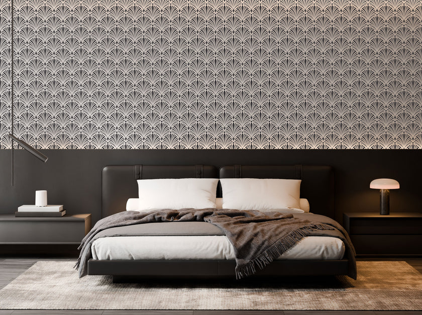 Art Deco wallpaper with repeating shell motifs in a black and off-white monochrome pattern. On bedroom wall behind bed. 