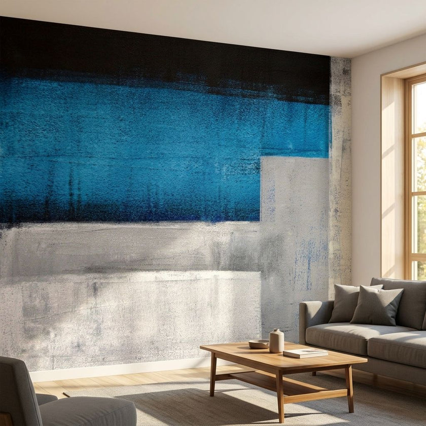Large blue textured wall mural titled 'Blue Me Away' in a modern living room with natural daylight and contemporary decor.