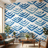 Blue Thingamabobs mural with seamless geometric pattern on a textured wall in a modern living room, highlighting vinyl texture and ambient lighting.
