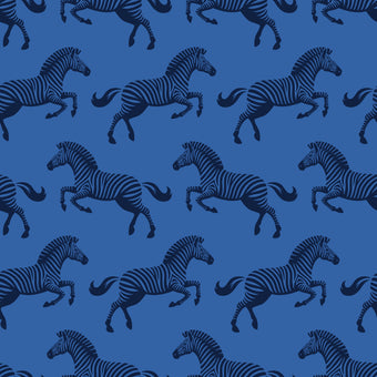 Repeating zebra wallpaper pattern featuring navy and royal blue zebras on a cobalt blue background. Zoomed in on the zebras. 