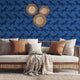 Repeating zebra wallpaper pattern featuring navy and royal blue zebras on a cobalt blue background. Wallpaper in a safari longe seating area, be hide the couch. 