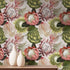 Botanical wallpaper with a seamless repeating pattern of hand painted blush pink proteas, cream anthuriums, and green foliage on a soft neutral background, styled behind a wooden cabinet with two white ceramic vases.
