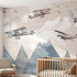 Vibrant large-scale children's nursery mural of a multicoloured airplane over mountains covering an entire wall.
