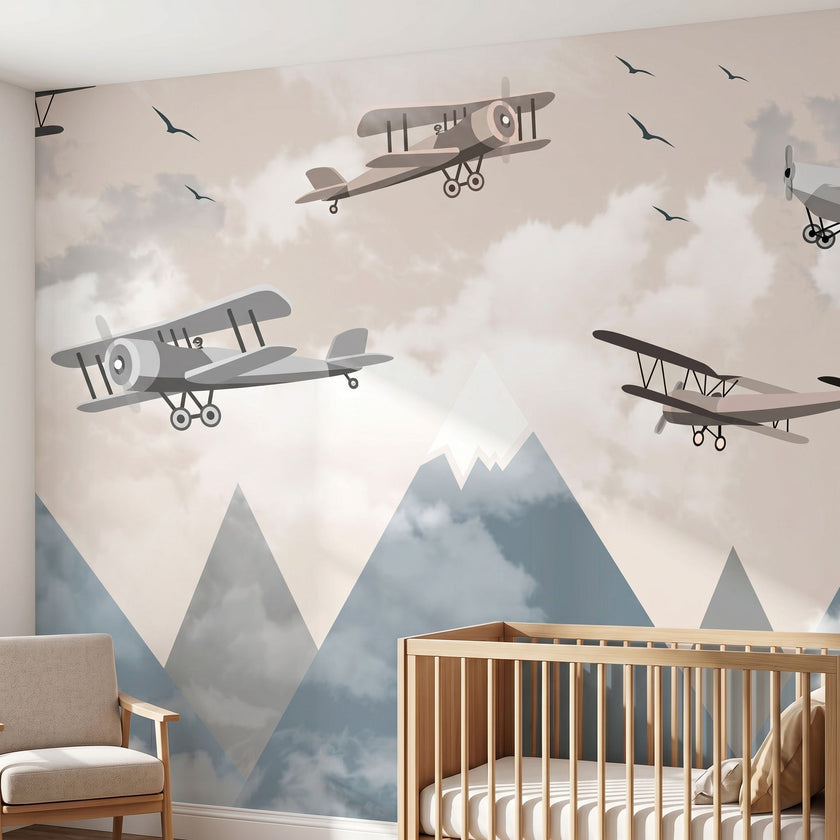 Vibrant large-scale children's nursery mural of a multicoloured airplane over mountains covering an entire wall.