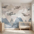 Detailed close-up of a multicoloured airplane and mountain scenery mural, emphasizing vibrant design and seamless wall coverage.