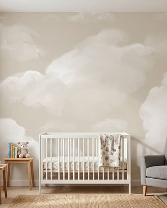 Seamless wall mural in a nursery featuring soft beige clouds on a calm sky, scaled to fit the entire wall with natural lighting.