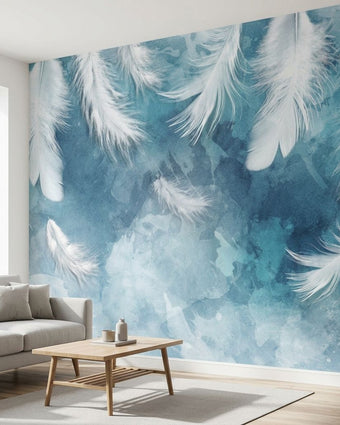 Vibrant blue feather and floral patterned mural covering an entire wall in a modern living room, illuminated by natural daylight.