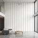Modern interior with beige geometric stripe wall mural covering entire wall with seamless pattern.