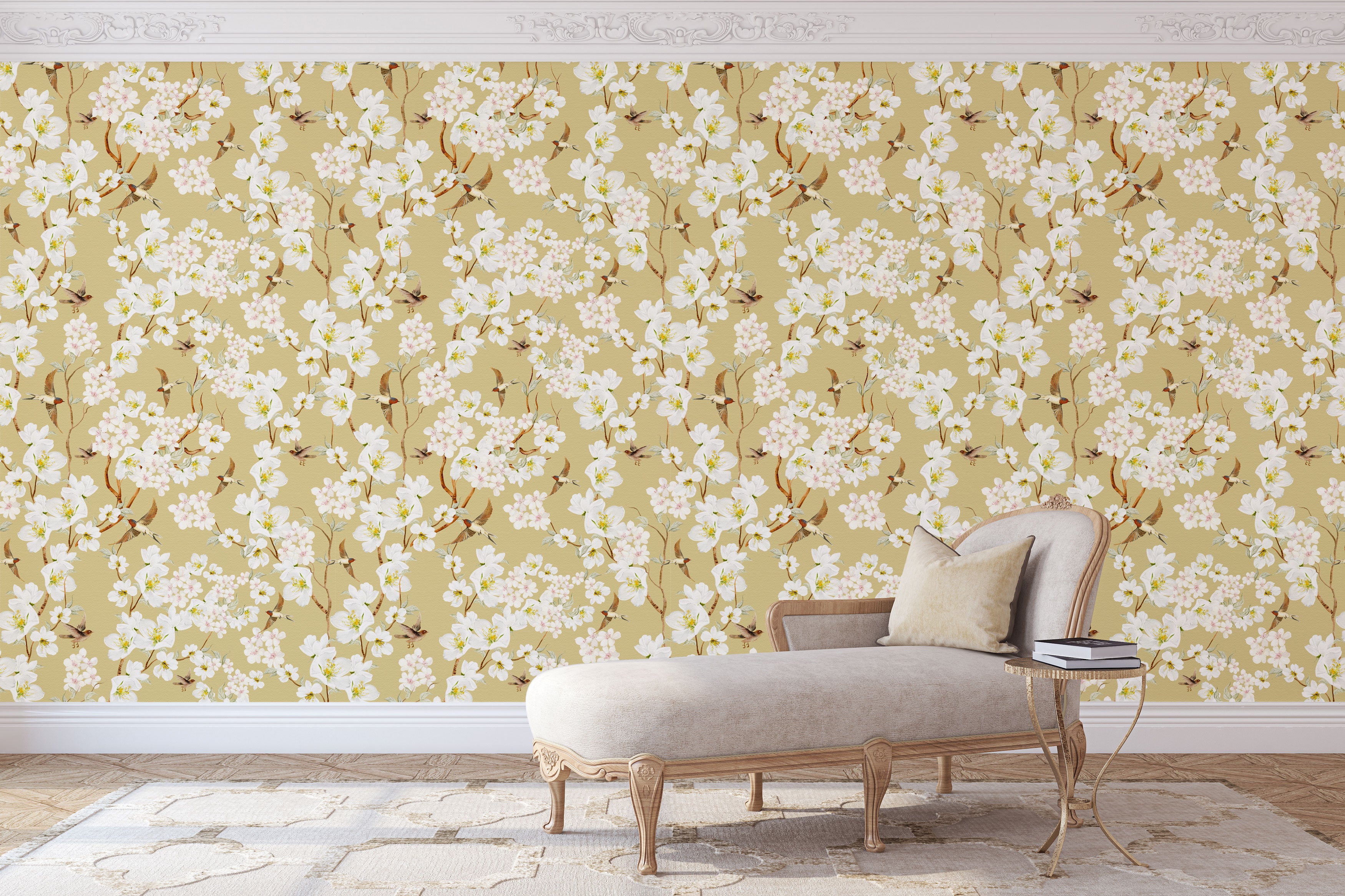 Vintage inspired wallpaper featuring white and blush blossom flowers, winding branches, and swallows in flight on a warm golden-beige background.