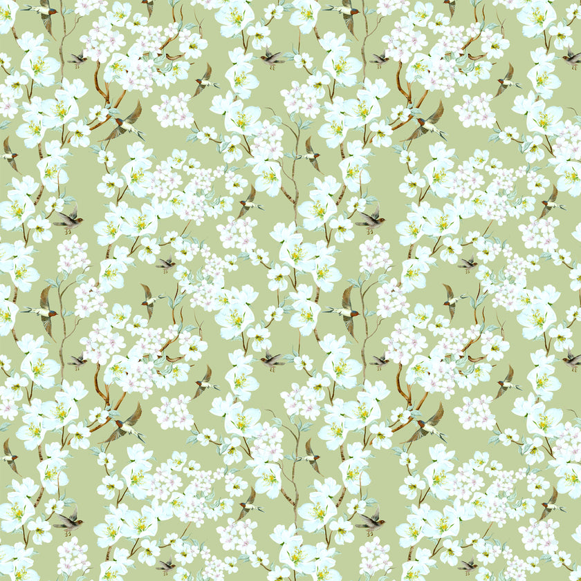 Chinoiserie inspired wallpaper featuring delicate white blossom flowers, flowering branches, and swallows in flight on a soft sage green background.