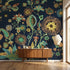 Vibrant navy floral wall mural with seamless pattern, filling a modern living room wall with detailed flowers and natural lighting.