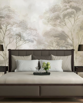 Soft neutral forest wallpaper featuring delicate misty trees in layered sepia and taupe tones with a hand sketched effect. On wall behind the bed.