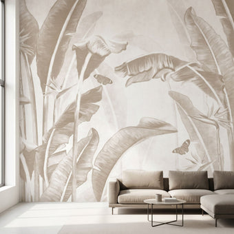 Realistic full-wall mural of dense tropical foliage with Stralizias floral and butterfly design in earthy tones, perfectly fitting a modern interior.