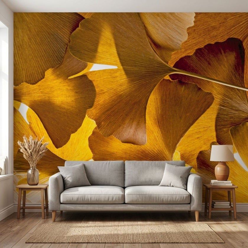 Ginko Balboa botanical wall mural with vibrant gingko leaves in a modern living room setting, seamlessly covering the wall without joins.