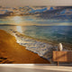 High-resolution beach sunset mural on a single wall, offering a serene ocean scene with a multicolored sky and calm waves.
