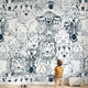 Full wall African animal mural in a kids' playroom featuring seamless elephants, giraffes, zebras, and white design elements.