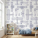 Kids' room with a white seamless mural featuring subtle plane patterns, illuminated by natural daylight, creating a balanced and vibrant space.