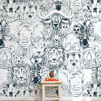 Entire wall African-themed mural with seamless elephants, giraffes, and zebras, filling a modern interior with vibrant colors and detail.