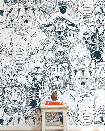 Entire wall African-themed mural with seamless elephants, giraffes, and zebras, filling a modern interior with vibrant colors and detail.