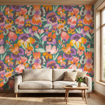 Dramatic mural of multicoloured playful pansies covering an entire wall in a lively interior setting.