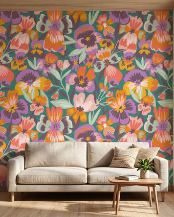 Dramatic mural of multicoloured playful pansies covering an entire wall in a lively interior setting.