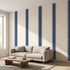 Expansive view of a mural covering an entire wall in a minimalist space with natural lighting, emphasizing vibrant geometric pattern.