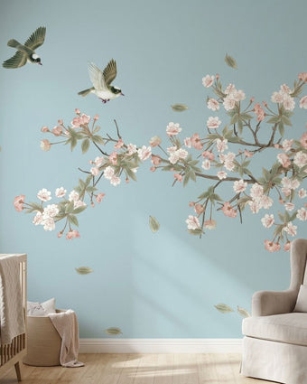 Vibrant chinoiserie-inspired floral mural with cherry blossoms and birds, perfect for a sophisticated nursery wall decor.