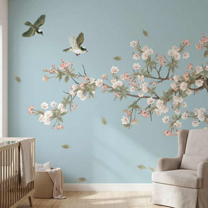 Vibrant chinoiserie-inspired floral mural with cherry blossoms and birds, perfect for a sophisticated nursery wall decor.