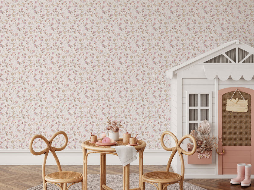 A styled interior scene featuring a
soft pink and neutral floral wallpaper with delicate flowers and leafy sprigs on a subtle striped background., with a small wooden table, two woven chairs, a white playhouse, and pink rain boots on the floor.