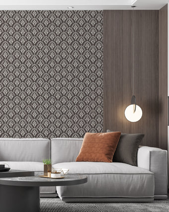 Art Deco wallpaper with repeating fan motifs in a dark neutral palette.  On lounge wall, behind couch. 