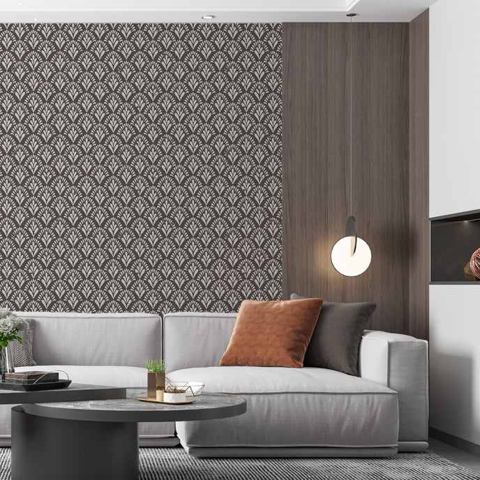 Art Deco wallpaper with repeating fan motifs in a dark neutral palette.  On lounge wall, behind couch. 