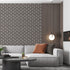 Art Deco wallpaper with repeating fan motifs in a dark neutral palette.  On lounge wall, behind couch. 