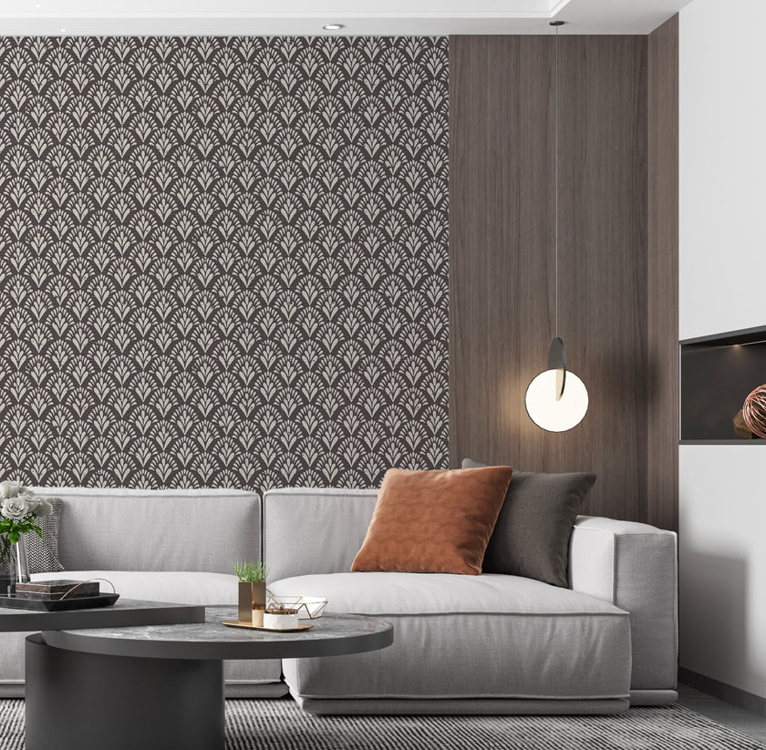 Art Deco wallpaper with repeating fan motifs in a dark neutral palette.  On lounge wall, behind couch. 