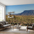 Immersive landscape mural showcasing mountains, forest, and river, covering entire wall with realistic textures and natural lighting.