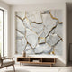 Artistically composed shot of marble fragments mural with natural daylight and high micro-detail, emphasizing texture and gold accents.