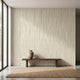 Minimalist scene with a fully covered wall mural of African-inspired geometric stripes in beige, emphasizing custom fit and detailed pattern.